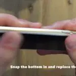 snap the bottom into place and replace the screws