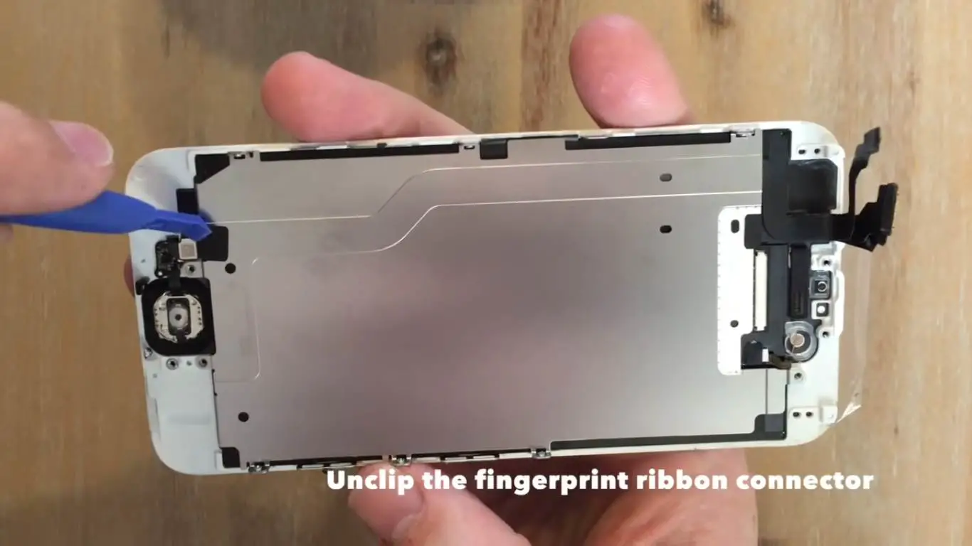 unclip the fingerprint ribbon connector