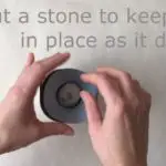 add a stone weight to keep the insert in place