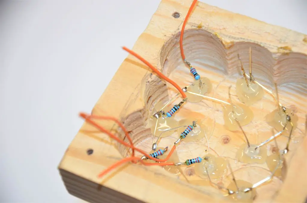 solder resistors the the leds
