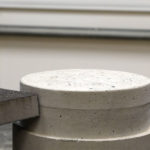 sanding the edges of the concrete