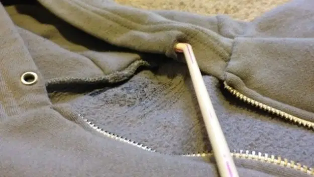 staple the hoodie cord to a straw