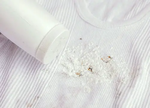 use baby powder to get oil stains out of your clothing