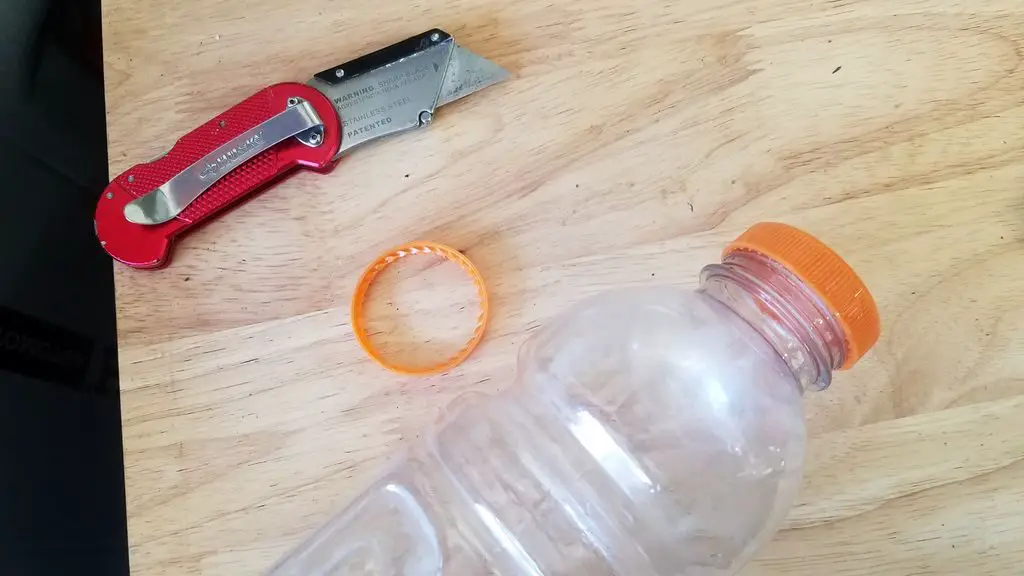 Cut The Ring Off Of The Neck Of The Bottle