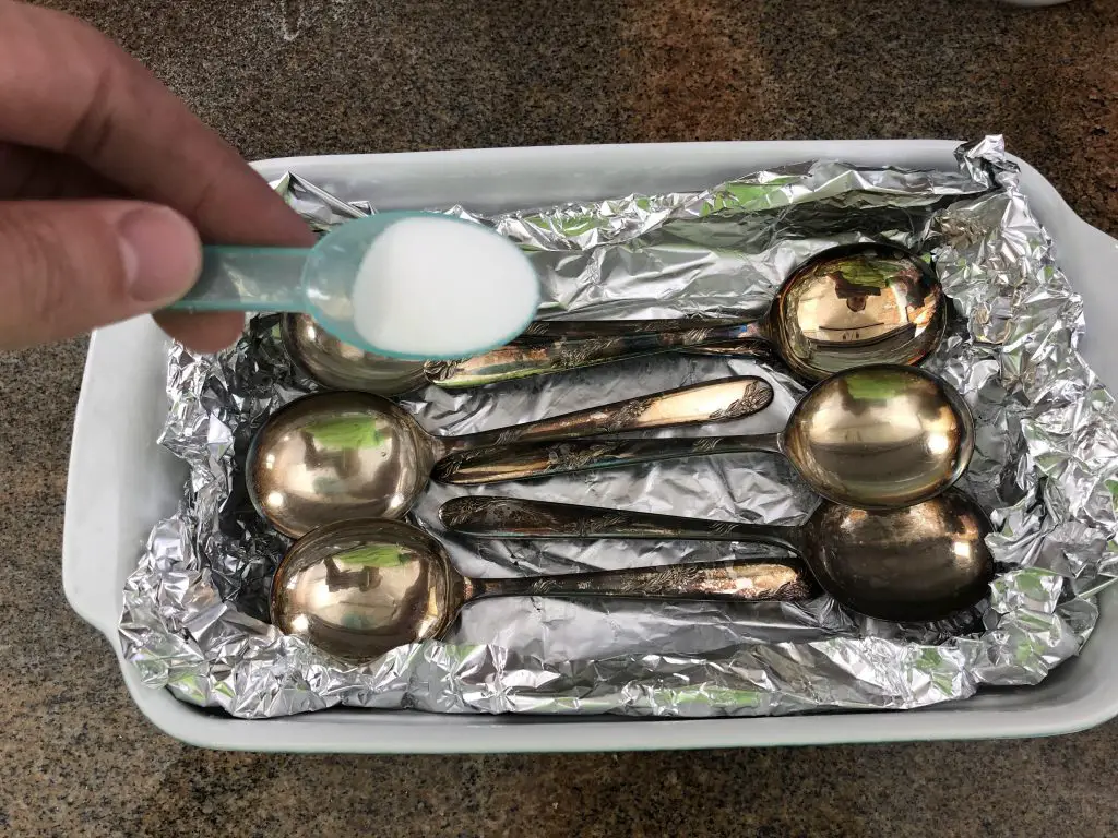 sprinkle the baking soda into the container The DIY Life