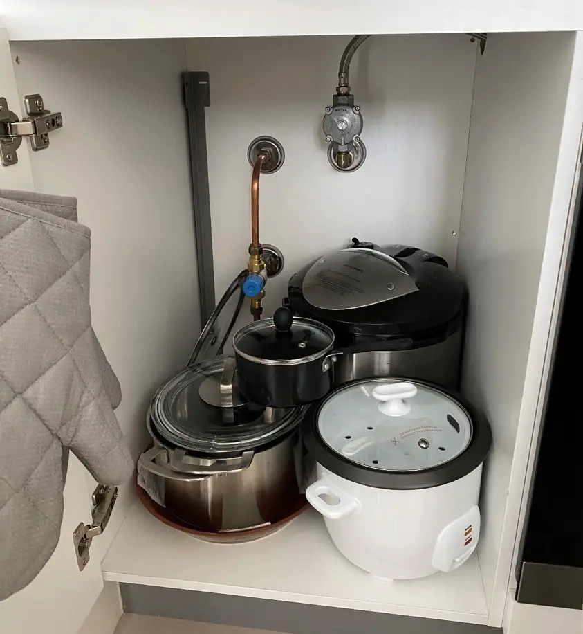 Cluttered Kitchen Cabinet With Wasted Space, Needs An Extra Shelf