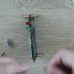 Screwing The Brass Standoffs Onto The Ticker