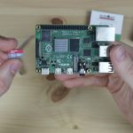 SanDisk MicroSD Card Plugging Into Raspberry Pi
