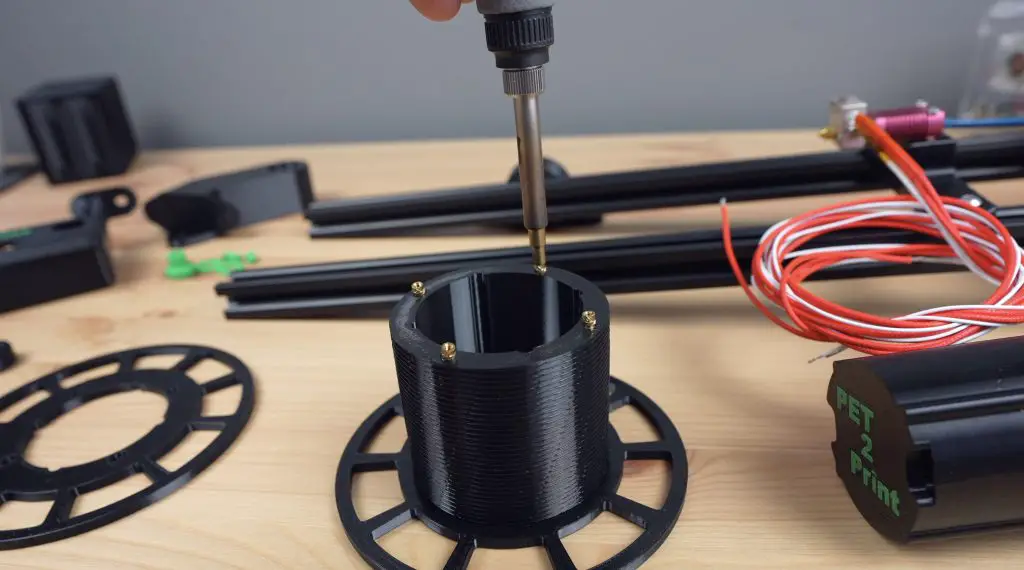 Brass Inserts Being Melted Into Reel